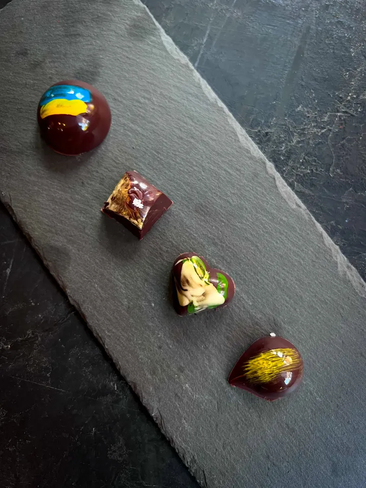 Four chocolate truffles arranged for the Ukraine fundraiser