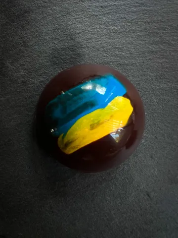 Ukraine fundraiser truffle decorated in blue and yellow